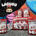 Figurka kolekcjonerska Labubu Pop Mart Coca-Cola The Monsters w opakowaniu blind box na tle graffiti